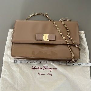 Lightly used Salvatore Ferragamo beige patent purse with gold chain